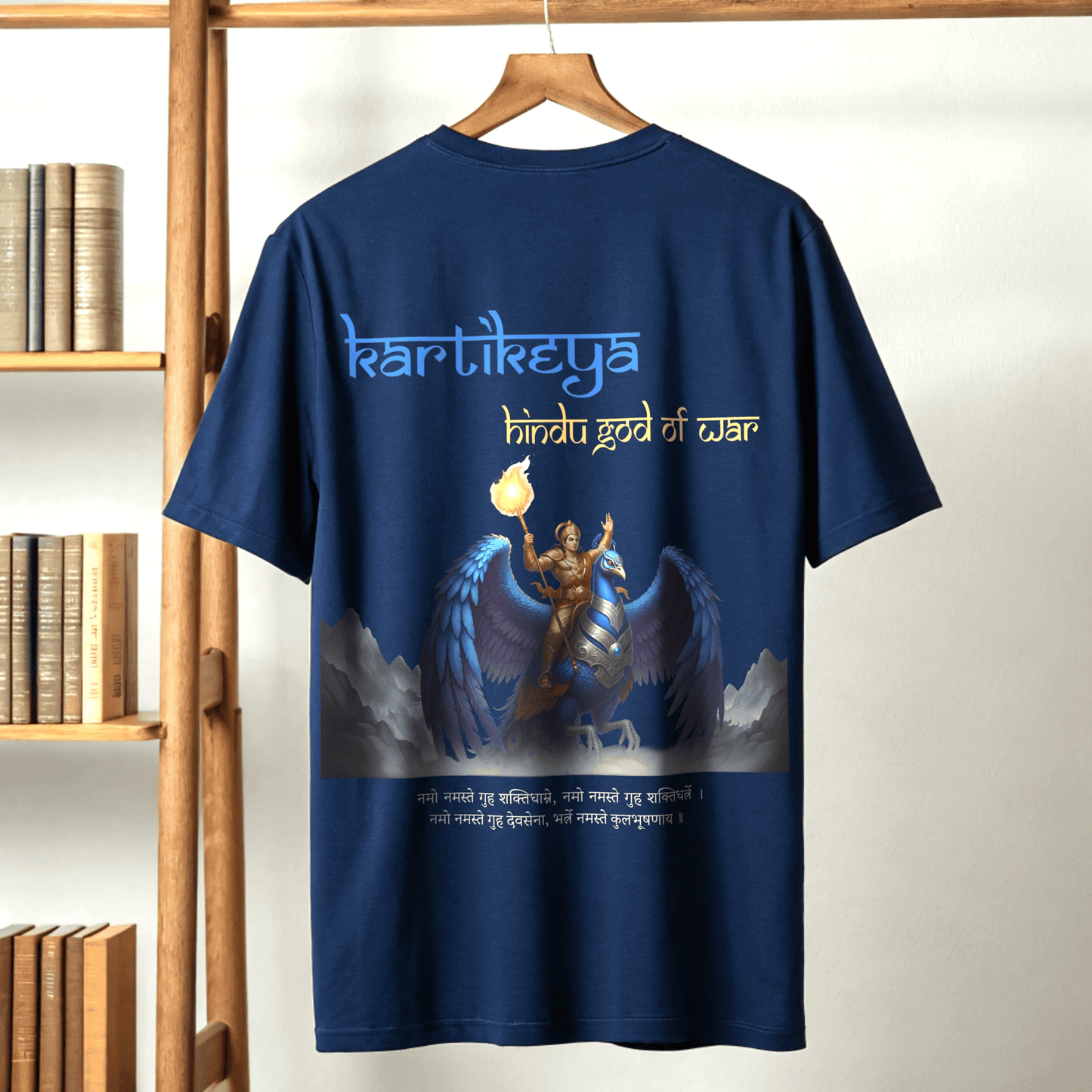 Royal Blue t-shirt with KARTIKEYA graphic design and text on a wooden hanger against a white wall By OFF THE RACK.