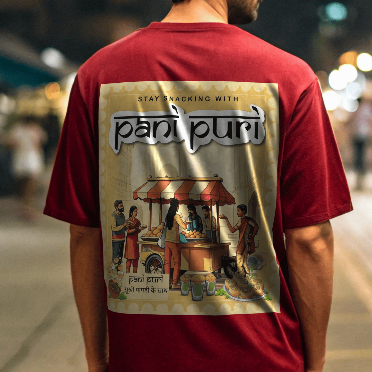 Person wearing a red t-shirt with 'pani puri' graphic design on the back By OFF THE RACK