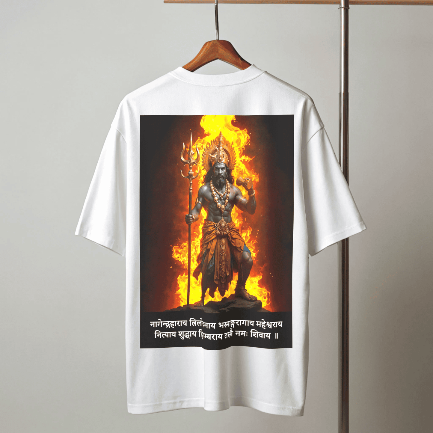 White t-shirt with a graphic of Shiva on fire hanging on a wooden hanger against a gray background By OFF THE RACK
