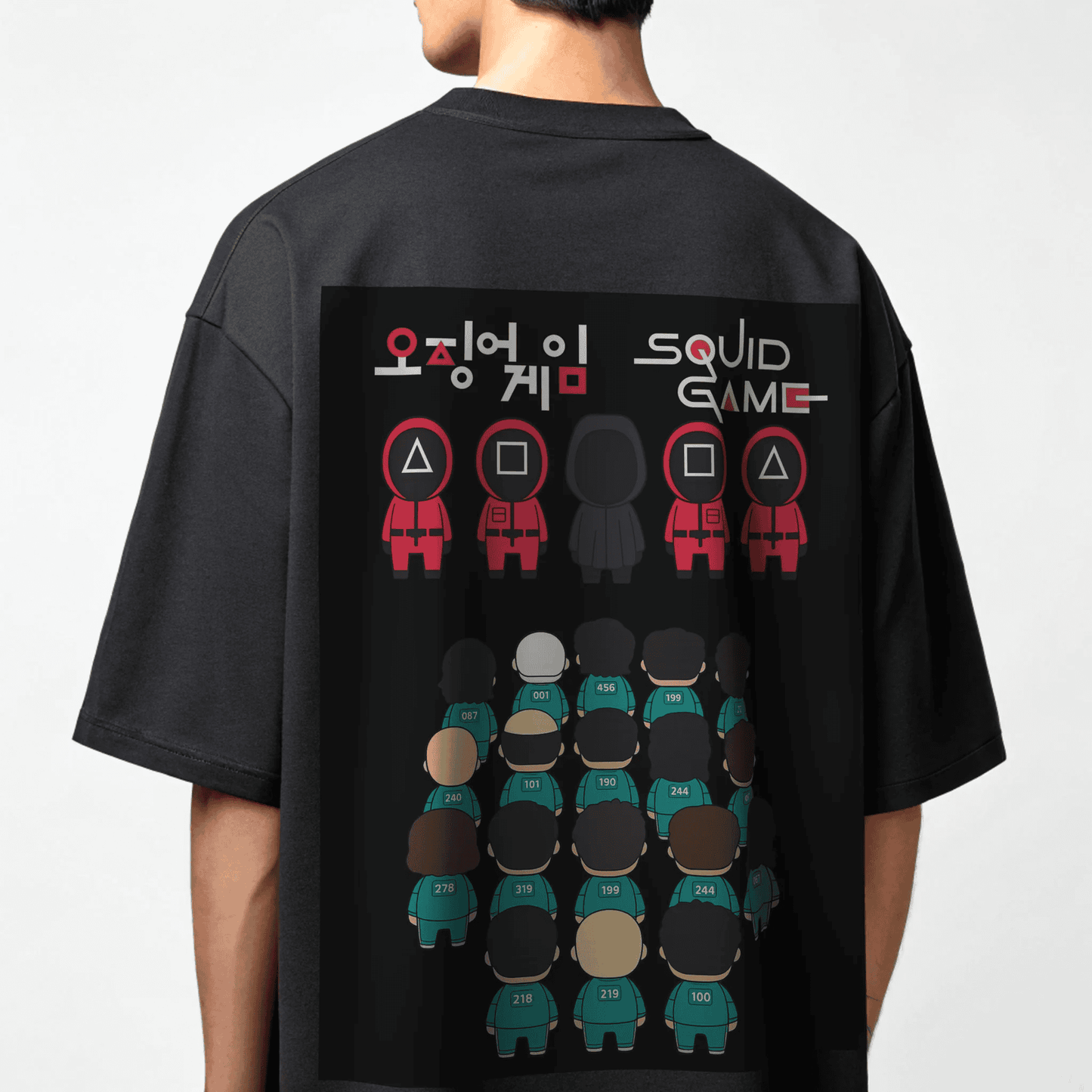 Black t-shirt worn by male model with 'Squid Game' design on the back, featuring characters and logo by OFF THE RACK